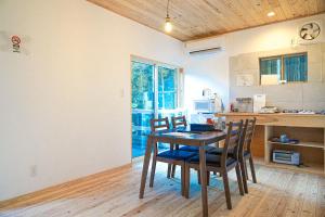 a kitchen with a table and chairs in a room at フォレスタ阿蘇車帰 in Aso +28 photos