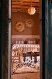 a living room with a couch and a table at MUMA Lodge in Marrakech