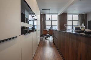 an office with a bar with a desk and a kitchen at Lodge No 147 - Stewarts Resort Cameron in Cameron