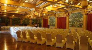 a large room with rows of chairs in it at The Silk Road Dunhuang Hotel in Dunhuang