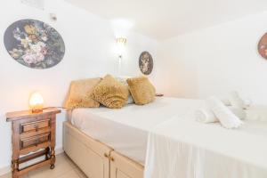 a bedroom with two beds and a night stand at Studio Sillero Dos in Moraira