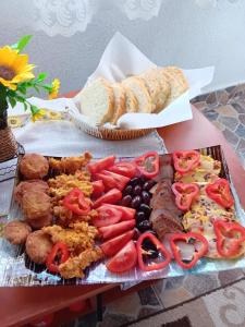 a tray of different types of food on a table at Lumea lui Creanga  +16 photos