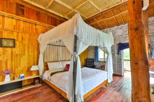 Ένα ή περισσότερα κρεβάτια σε δωμάτιο στο Om Yoga Resort