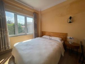 Ένα ή περισσότερα κρεβάτια σε δωμάτιο στο Tourist Apartment Baluwatar