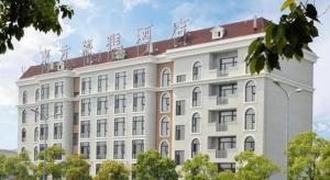 上海市にあるMuyra Hotel Shanghaiの上に時計がある大きな白い建物