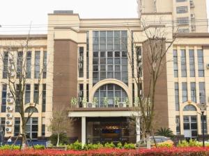 a large building with a lot of windows at GreenTree Inn Suzhou Changshu Southeast Development Zone Southeast Avenue in Gujiashuigou