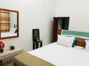 Ένα ή περισσότερα κρεβάτια σε δωμάτιο στο Ritigala Nature Villa