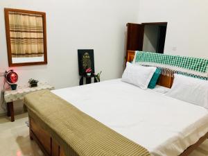 Ένα ή περισσότερα κρεβάτια σε δωμάτιο στο Ritigala Nature Villa +13 φωτογραφίες