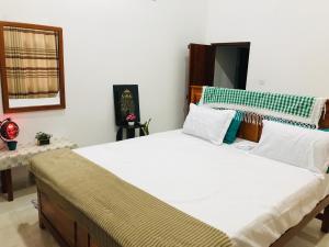 Ένα ή περισσότερα κρεβάτια σε δωμάτιο στο Ritigala Nature Villa