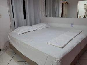 Ένα ή περισσότερα κρεβάτια σε δωμάτιο στο kitnet Ceu