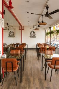 a row of tables and chairs in a restaurant at Patong Platinum in Patong Beach