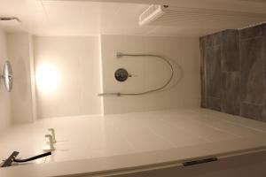 a bathroom with a shower and a sink at Am Barthelwald in Wilhelmsdorf +18 photos