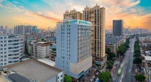 a view of a city with tall buildings at City Comfort Inn Nanning Guangxi University Xiuling Road Metro Station in Nanning