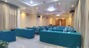 a large room with blue tables and chairs at Hotel Intan Cirebon in Cirebon +52 photos