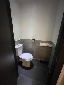 a bathroom with a toilet and a sink at Appartement en bord de mer in Sainte-Maxime +5 photos