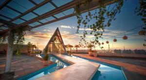 a swimming pool on top of a building at The Rinra in Tanjungbunga