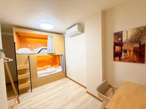 Ένα ή περισσότερα κρεβάτια σε δωμάτιο στο 晴天ハイム