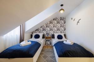 Ένα ή περισσότερα κρεβάτια σε δωμάτιο στο Deluxe Design Apartman