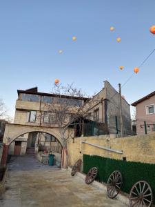 an old building with a bunch of wheels in front of it at Glorious House Goreme in Nevsehir