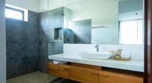 a bathroom with a sink and a glass shower at K.K inn Boutique Siem Reap in Siem Reap +80 photos