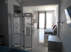 a living room with a gate in a room at Petrakis sunset in Palaiochora