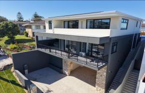 an aerial view of a house with a balcony at Beach House Perth in Perth