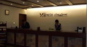 two people sitting at a counter in a restaurant at Hotel Harvest Tateshina in Tateshina +125 photos