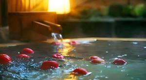 a bunch of cherries floating in a pool of water at Hotel Tokoen in Yonago