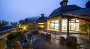 a large building with a lot of windows at Hotel Silk Onsen Yamabiko in Izushi