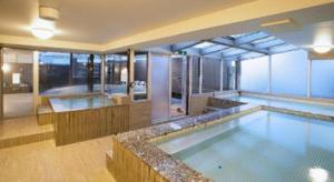 a large swimming pool in a building at Ikebukuro Royal Hotel in Tokyo