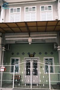 a house with a fence in front of it at City-Center Heritage Getaway for 12 Pax in George Town