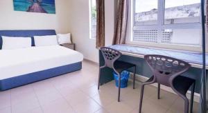 Postel nebo postele na pokoji v ubytování Station Hotel Klang