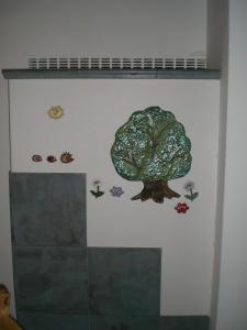 a wall with a tree and insects on it at Apartment Karin in Lutzmannsburg