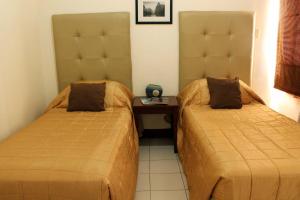 Łóżko lub łóżka w pokoju w obiekcie La Casarita