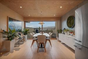 a dining room with a table and chairs at Northstay - House of Northern Lights in Tromsø
