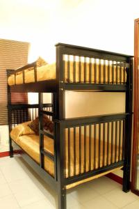 a pair of bunk beds in a room at La Casarita in Manila
