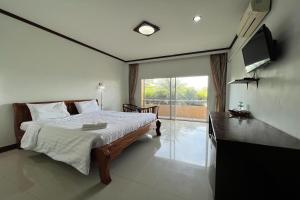 Postel nebo postele na pokoji v ubytování Mayuree Resort