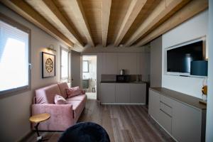 Μια τηλεόραση ή/και κέντρο ψυχαγωγίας στο CA' del SAL LUXURY APARTMENTS