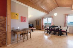 a dining room with a table and chairs at Weingut Ringwald in Herbolzheim