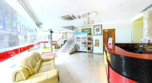 a living room with a couch in a store at OYO 90623 Thank Q Inn 3 in Kota Bharu