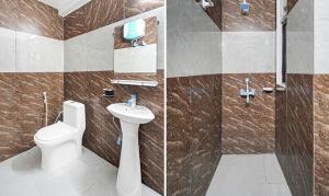 a bathroom with a toilet and a sink at Golden Sky in Noida