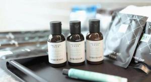 three bottles of essential oils sitting on a counter at Xana Hotelle Zhuhai Gongbei Port in Zhuhai