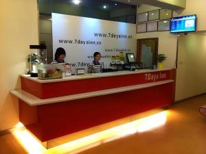 two women sitting at a counter in a restaurant at 7 Days Inn Guangzhou Huangpu East Zone Times Plaza in Guangzhou