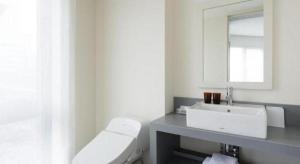 a bathroom with a white sink and a mirror at Hotel Edit Yokohama in Yokohama +87 photos