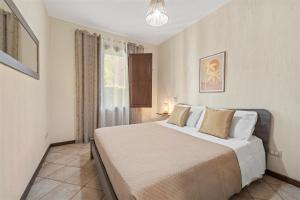 a bedroom with a bed and a window at Casa Lisa Agorà mare e relax in Villasimius