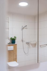 a bathroom with a shower and a toilet and a sink at Radawnica pl - Tu odpoczniesz! in Skorka +58 photos