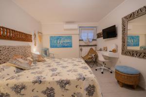 En eller flere senge i et værelse på Villa Liliana - Ancora - Esclusivo con Accesso Diretto alla Spiaggia