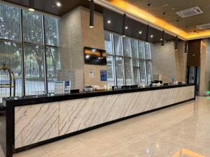 Ο χώρος του λόμπι ή της ρεσεψιόν στο Guangzhou Xiangxue International Apartment +22 φωτογραφίες