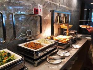 a buffet line with many different types of food at Hongqiao Pujue International Zhongshan Park Metro Station in Shanghai