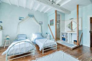 Postel nebo postele na pokoji v ubytování Gite Le Marquès